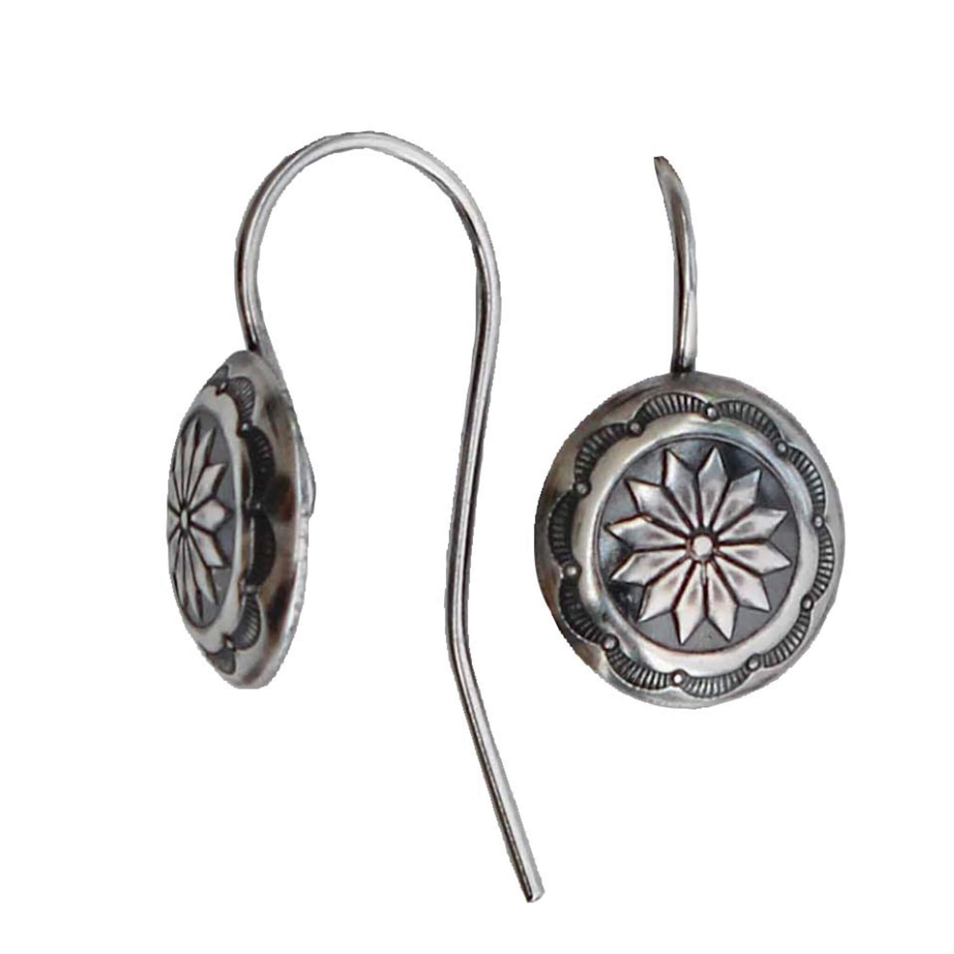 Concho Cowgirl Earrings made with Sterling Silver that feature a detailed design on fishhook ear wire. Antiqued sterling silver. Design may vary slightly from that shown. Made in USA.