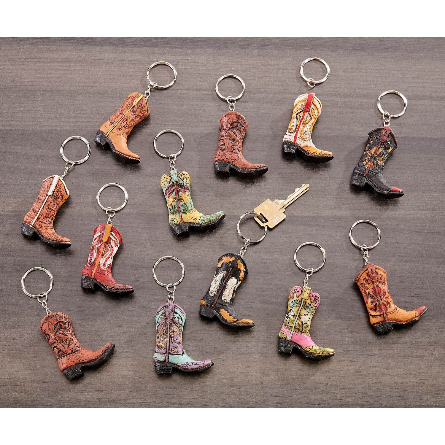 Fun detailed cowboy boot keychains to keep all your keys organized. Sold Individually. Assorted styles. 2 inch tall boot with chain and keyring.