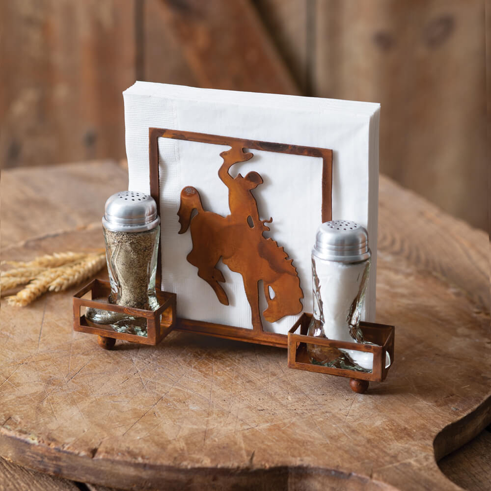 Our western caddy will lasso you in with its daring cowboy, precious salt and pepper shaker boots, and rustic finish. Display on a table for easy access to salt, pepper, and napkins during a meal. Please wash shakers before use. Measurement: 8½''W x 3½''D x 6''H