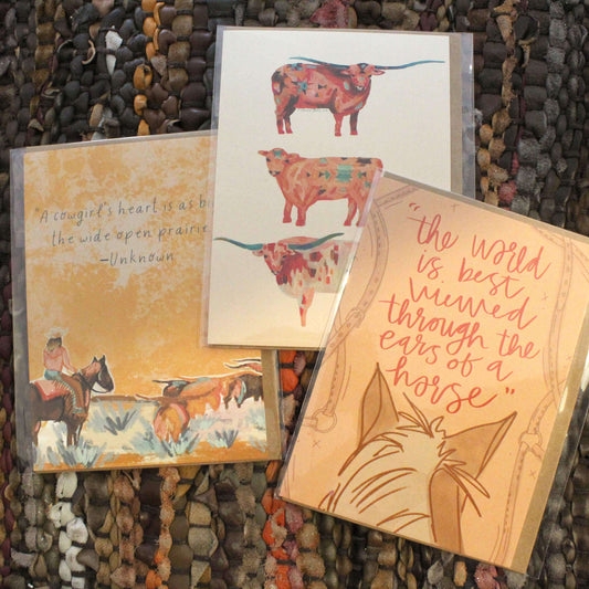 Cowgirl & Cowboy Western Greeting Cards Blank featuring colorful illustrations and quotes on a textured background.