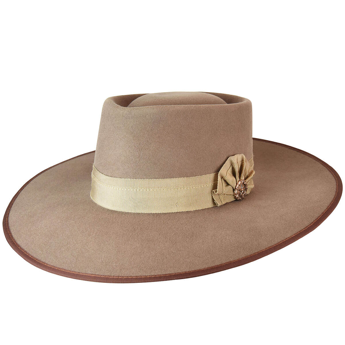 The Cowpuncher is a show-stopper style. Dress it up or dress it down, the Cowpuncher is a must have. This buckaroo style hat features a grosgrain band and brim binding, accented with antique copper large star concho, and a small silver spur pin. It is fully lined and has a comfort sweatband to wick away moisture.