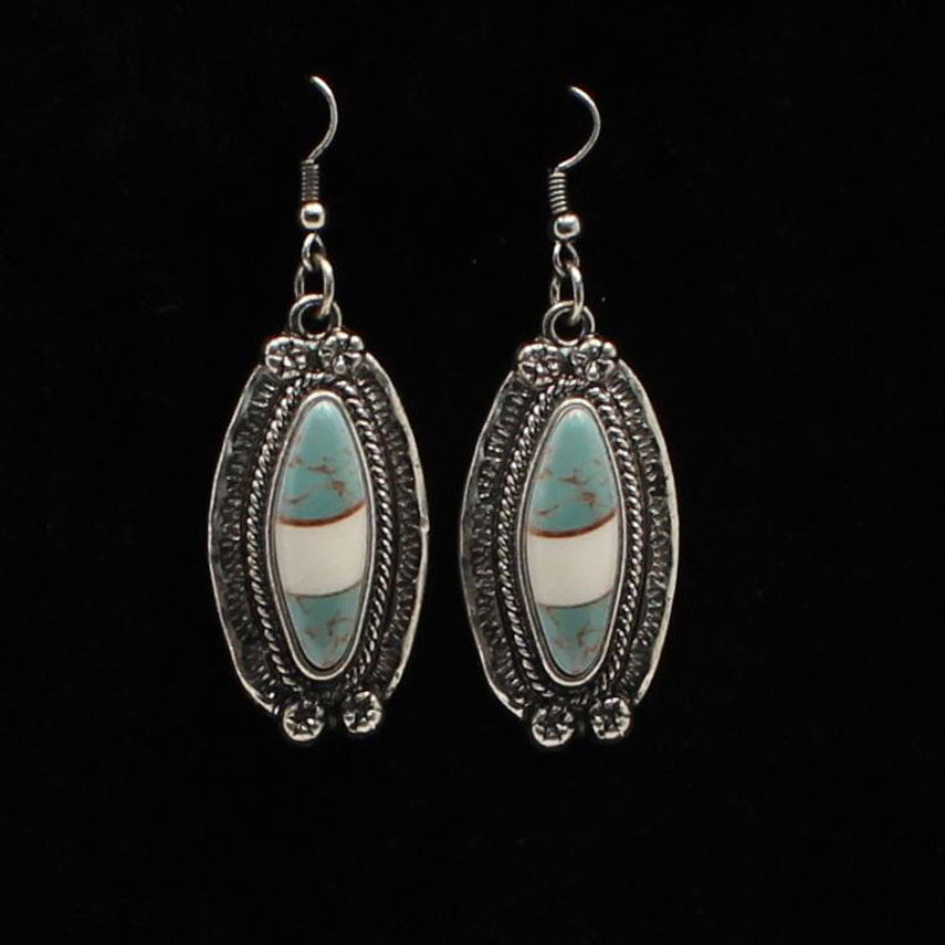 Antique silver setting with turquoise and ivory marbled stone in the center. French hook style. Ladies Western style earrings with silver and turquoise.