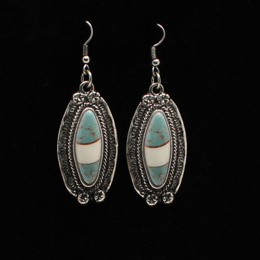 Antique silver setting with turquoise and ivory marbled stone in the center. French hook style. Ladies Western style earrings with silver and turquoise.