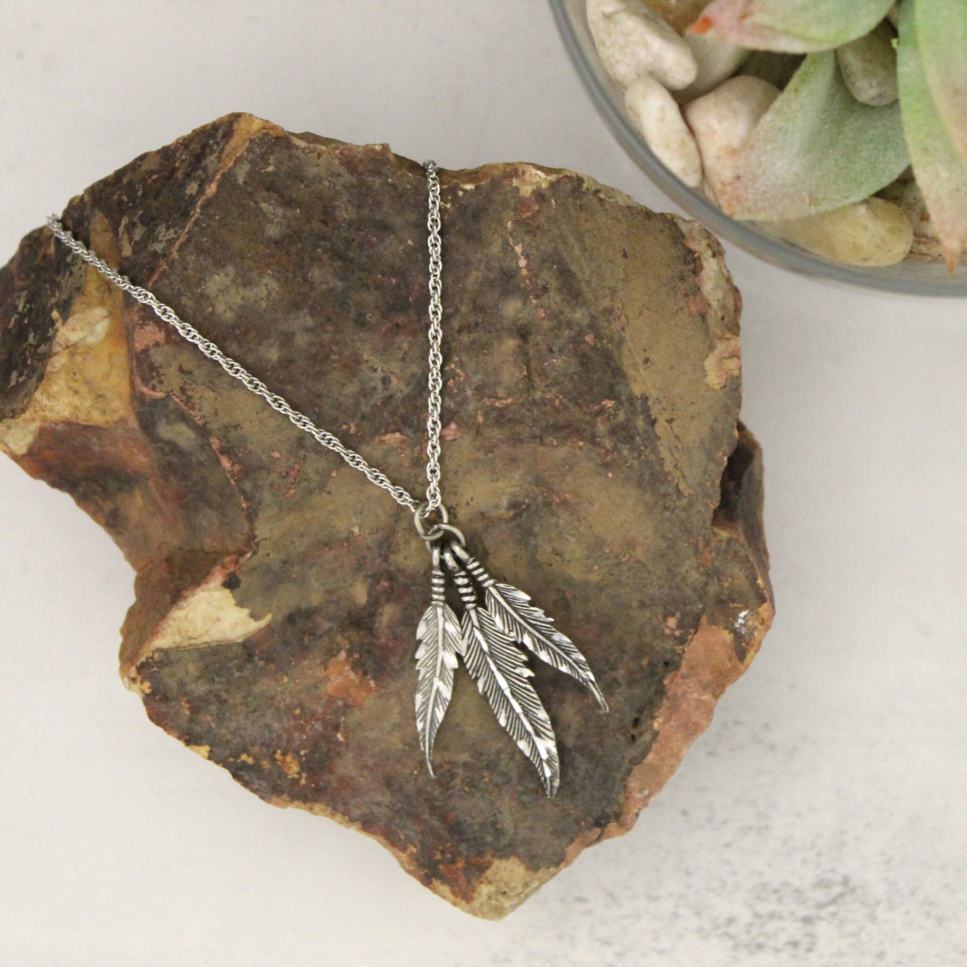 Feather necklace that will appease so many styles. Destiny pewter jewelry are made of fine jeweler's pewter that is extremely lightweight and has a brilliant shine. Each piece is handmade and hand finished with diamond cuts. The sparkly cuts give each piece a unique dazzling sparkle. Made in USA