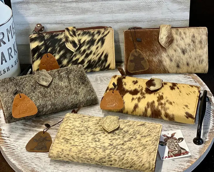 Genuine cowhide with double zipper this is one of the best quality wallets we have seen with all the must haves. Two zipper pockets, lots of card storage, perfect size of 7 x 4 inches. No two are exactly alike. Handmade in Paraguay.