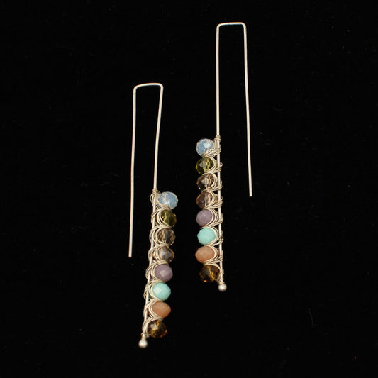 These stylish earrings are a threader style hook with silver finish. Multi color pastel beads on the end. Unique earrings that make a cowgirl statement!&nbsp;