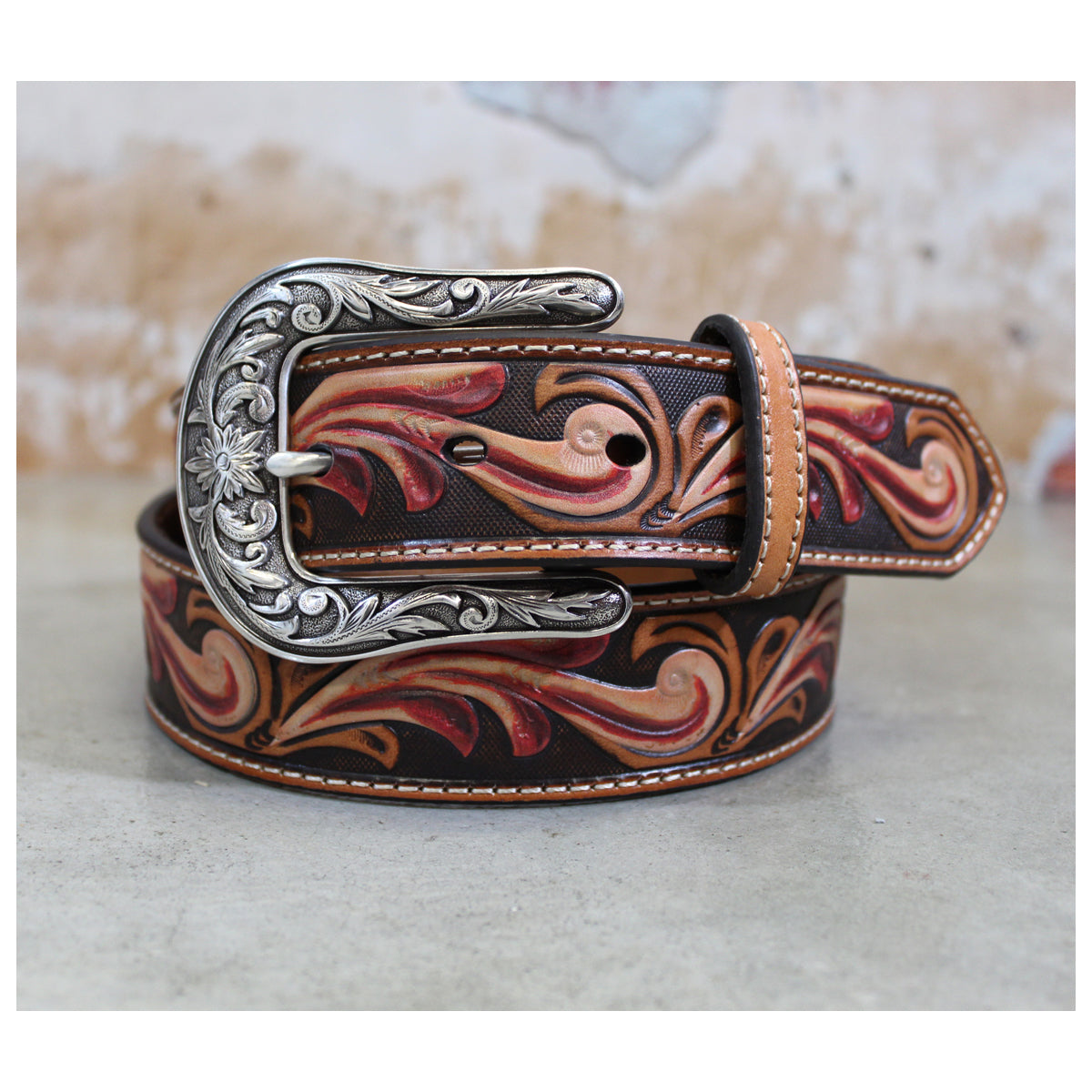 This genuine leather and has a floral embossing down the body of the belt. Features a rosy pink and ivory accent and is pretty in person. Belt is 1-1/2" wide with removable buckle. Imported.