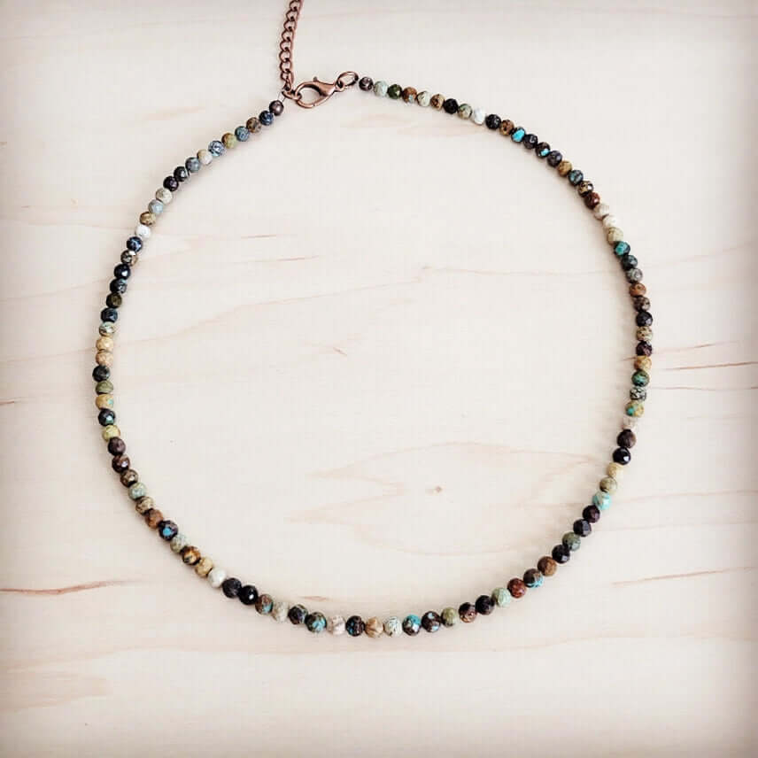 Faceted Genuine Hubei Turquoise Beaded Collar Necklace on wooden background, showcasing a handcrafted design with stunning beads.