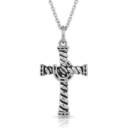 This necklace is a reminder that our faith gives us strength, just as the horseshoe does for a horse. A strong design consisting of a silver-tone twisted rope cross, antiqued for a dark look. In the center intertwined within the cross by only one side is a horseshoe that sit in the center. The necklace hangs from a 22 inch chain. Pendant approximately 1" x 2"