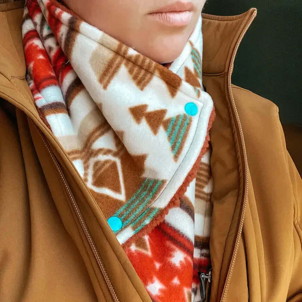 Close-up of a person wearing colorful Fleece Cowboy Cowls neck warmer, showcasing soft fleece and stylish patterns.