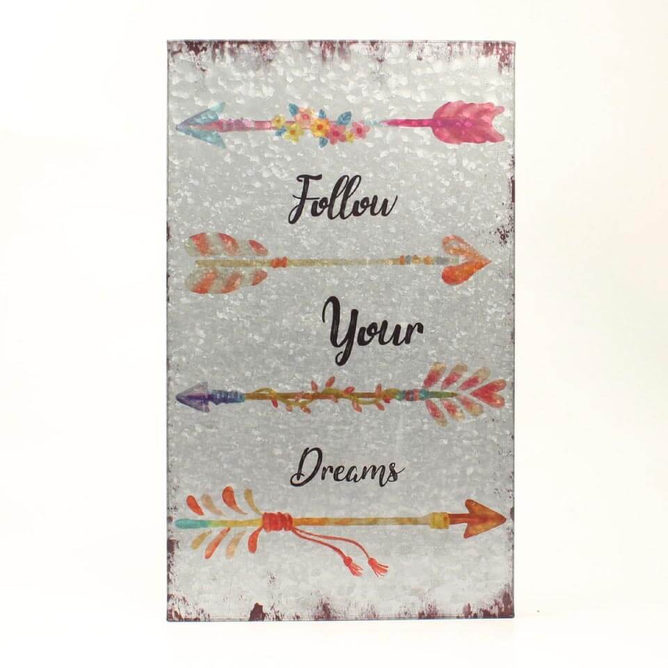 Add an authentic rustic feel to your home with this wall hanging. The metal sign has 4 arrows and the words Follow Your Dreams between the arrows. This inspirational wall hanging would make a great gift for that special person in your life, or buy for yourself.