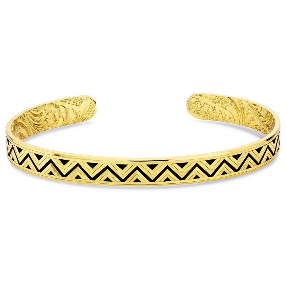 Gold bracelet with black chevron pattern on a white background