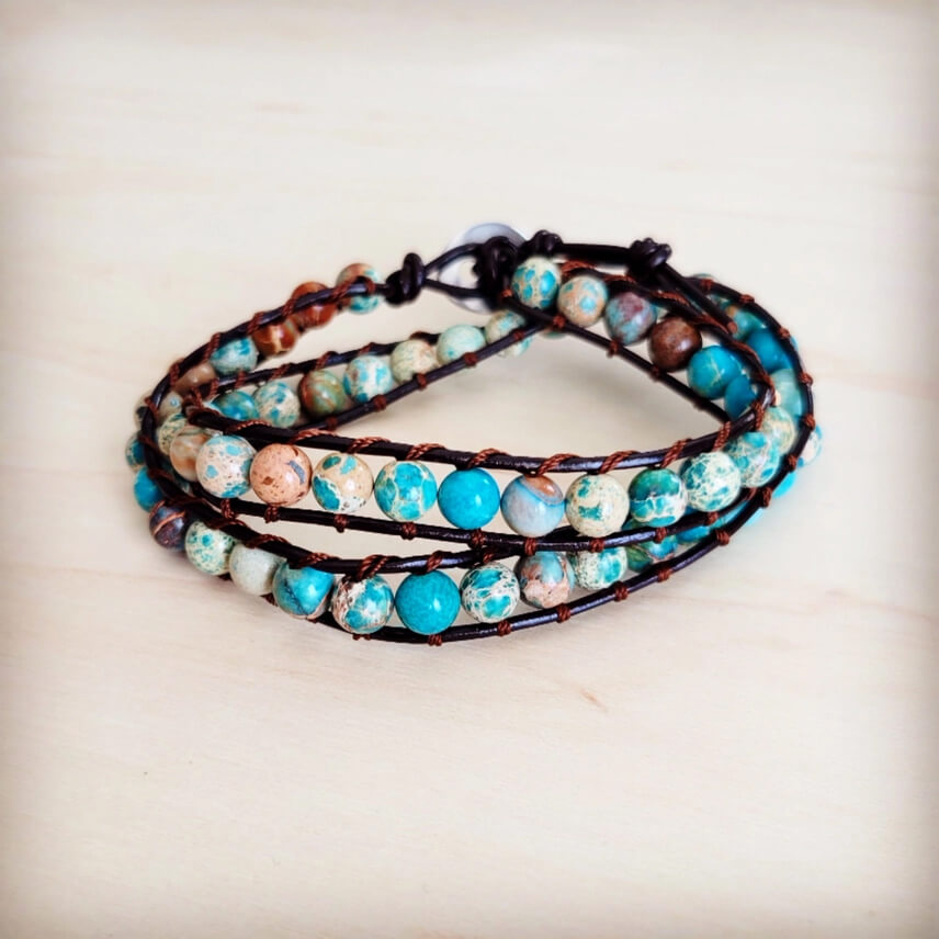 Wap bracelet with turquoise and brown beads on a light background