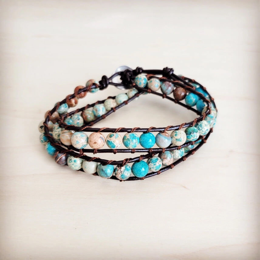 Multistrand bracelet with turquoise and brown beads on a light background