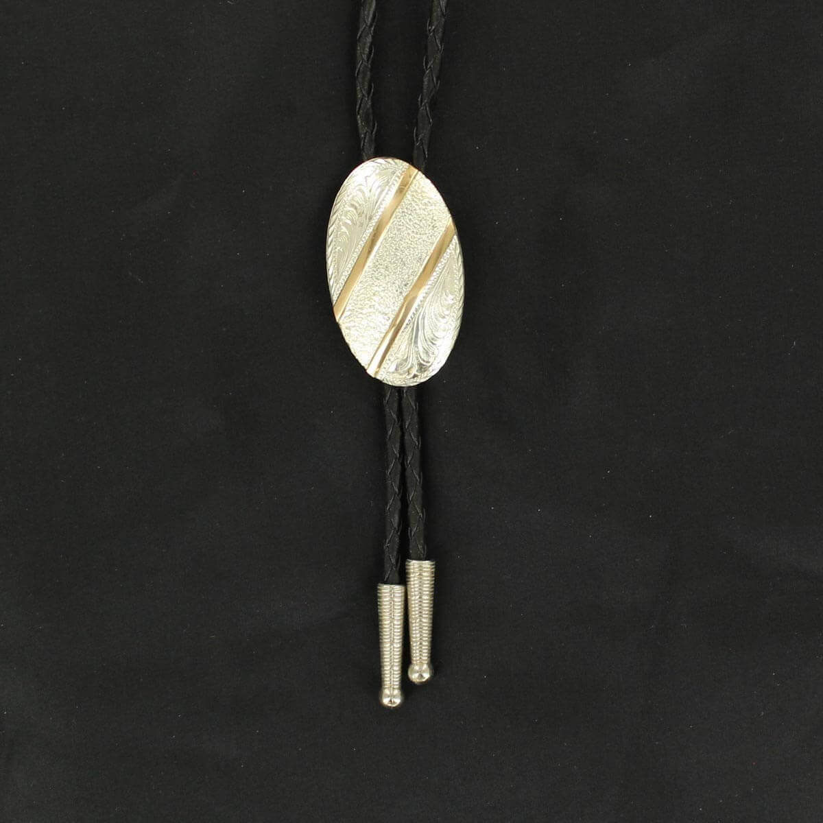 Gold Bar Men's Silver Western Bolo Tie with oval concho and black braided cord, featuring polished silver tips.