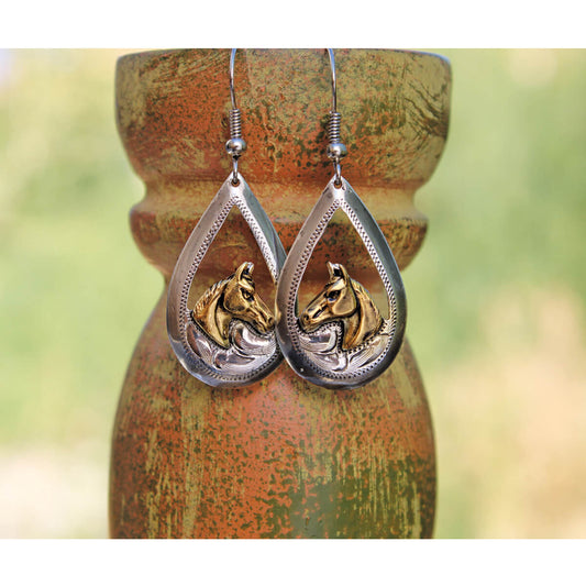 Show off the horse lover side of you in these earrings. Tear drop shaped silver framing a horse head. Measures 1-¼” x ⅞”. Hypo-allergenic ear wire.