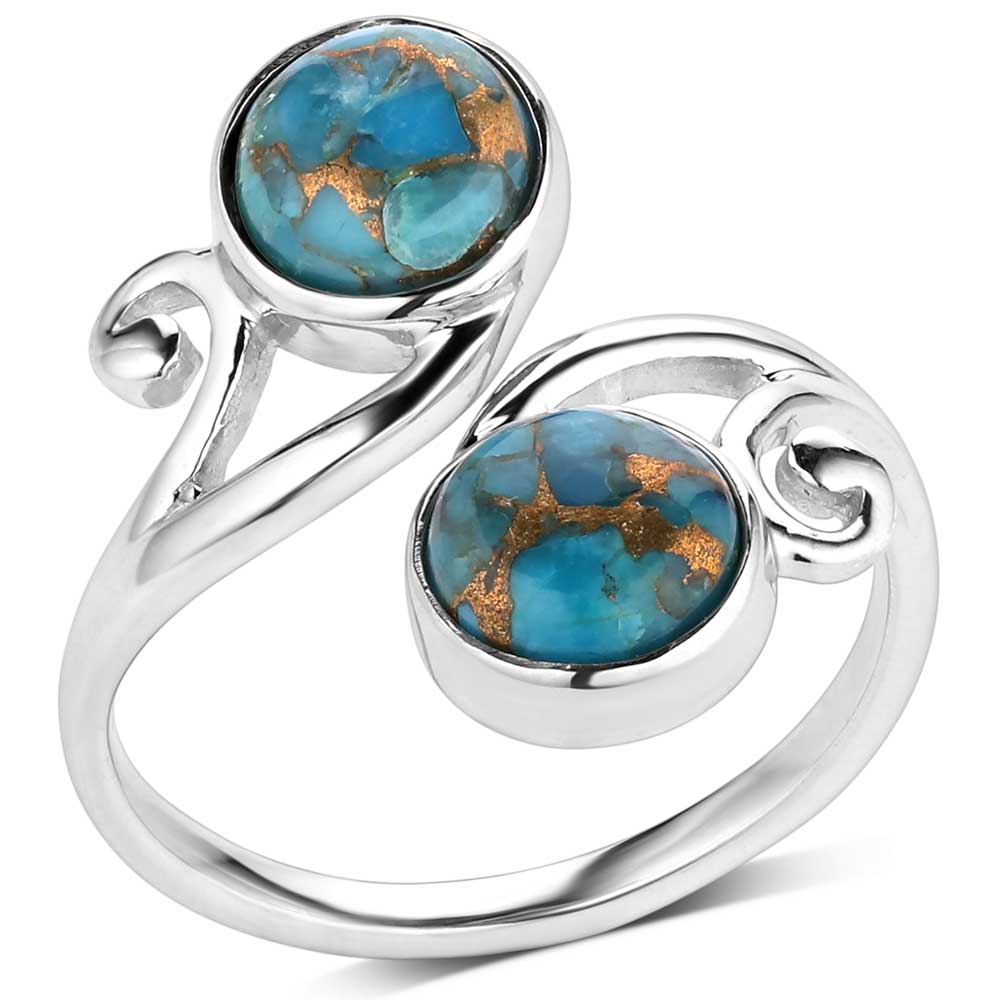 The Perfect Harmony Turquoise Ring embodies beauty and elegance. The main feature of this ring is two round turquoise stones streaked with copper. These turquoise stones sit on the end of this silver wrap ring creating a balanced design. One size fits most. Stone color may vary.