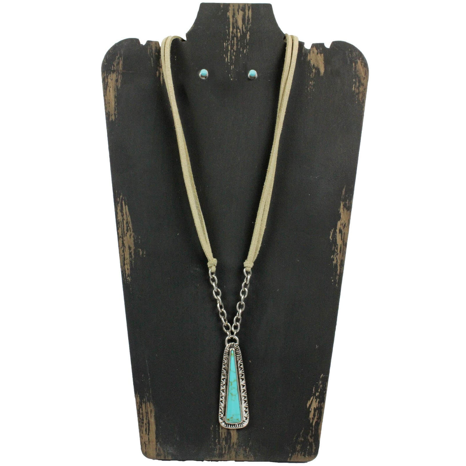 A triangle shaped mag turquoise cabochon pendant suspended below silver links and a leather chain. Tan leather chain measures 22″ with lobster claw clasp and extension. Matching hypoallergenic mag turquoise ball stud earrings.