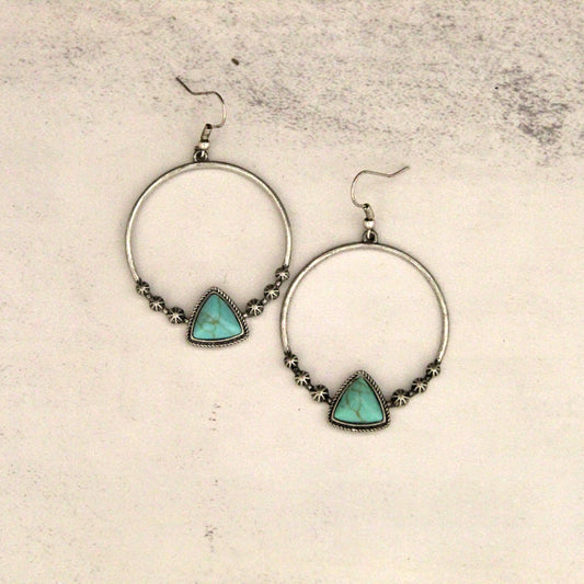 Western jewelry for women has a certain style and feel you just can't help but love. These western turquoise hoop earrings for women come with wire hooks and triangle turquoise accent. The western jewelry set go well with almost all kinds of outfits. It is good for daily wear or that special event. Hangs 2-1/2" down with a 1-1/2" diameter hoop.