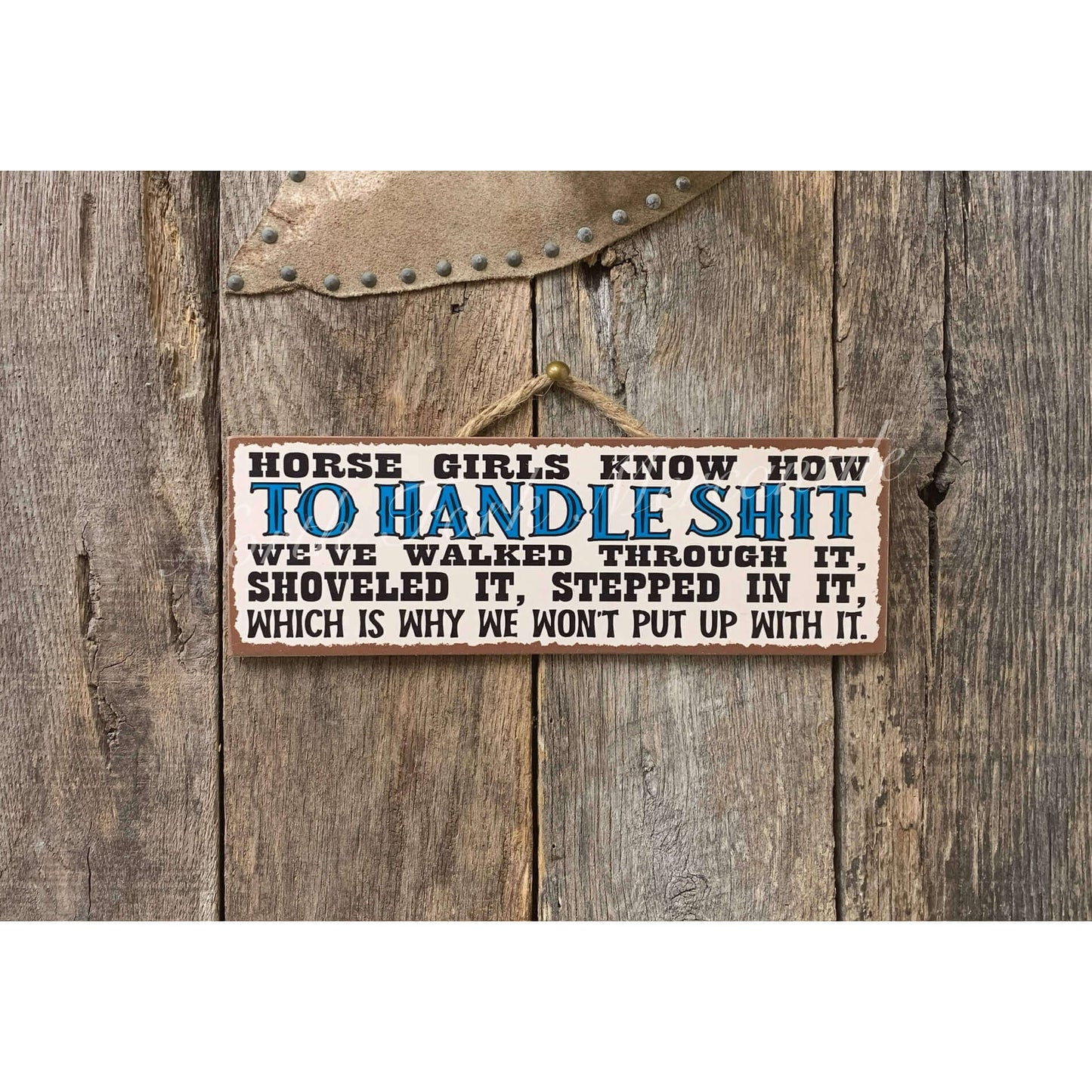 Wooden sign with text on a rustic wooden background