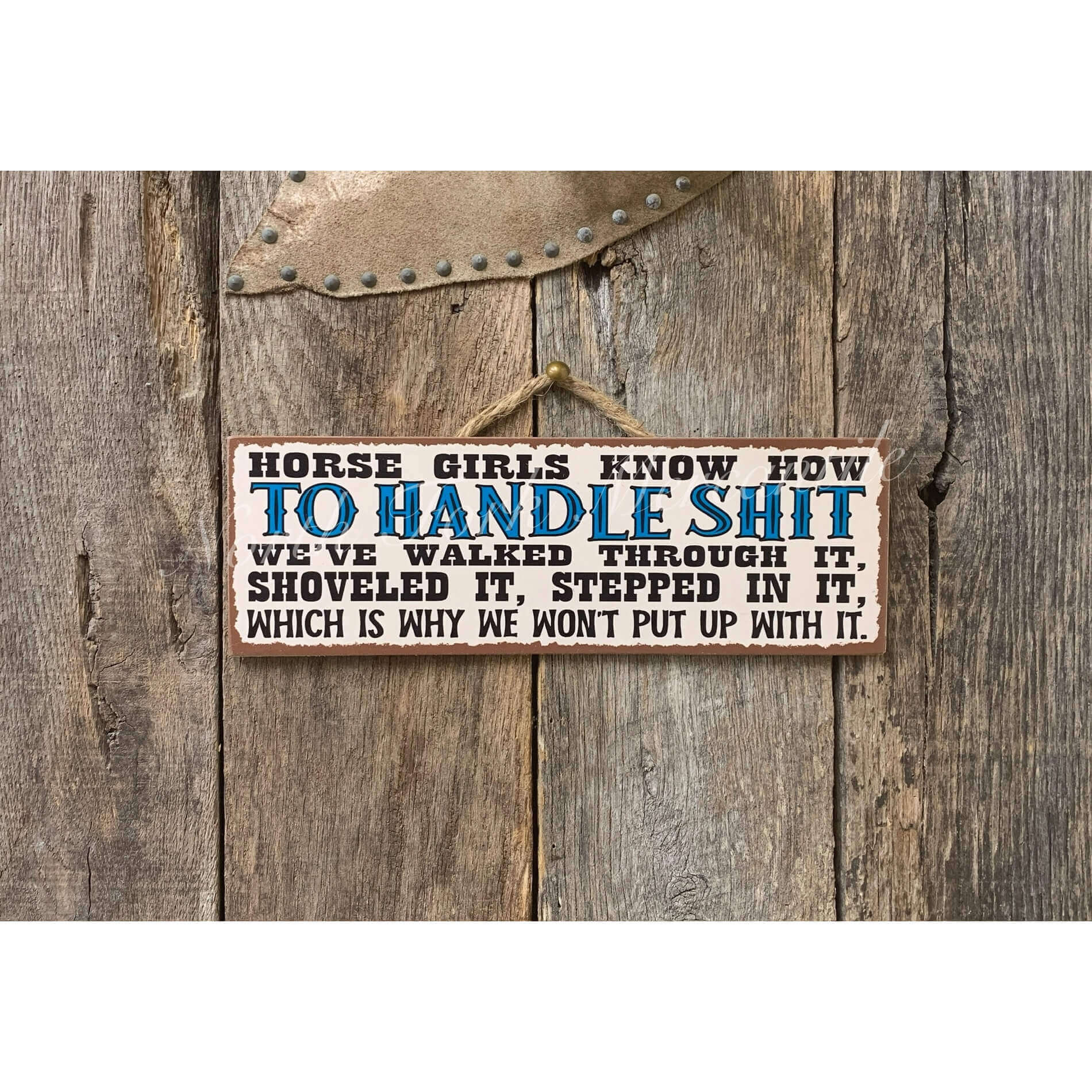 Wooden sign with text on a rustic wooden background