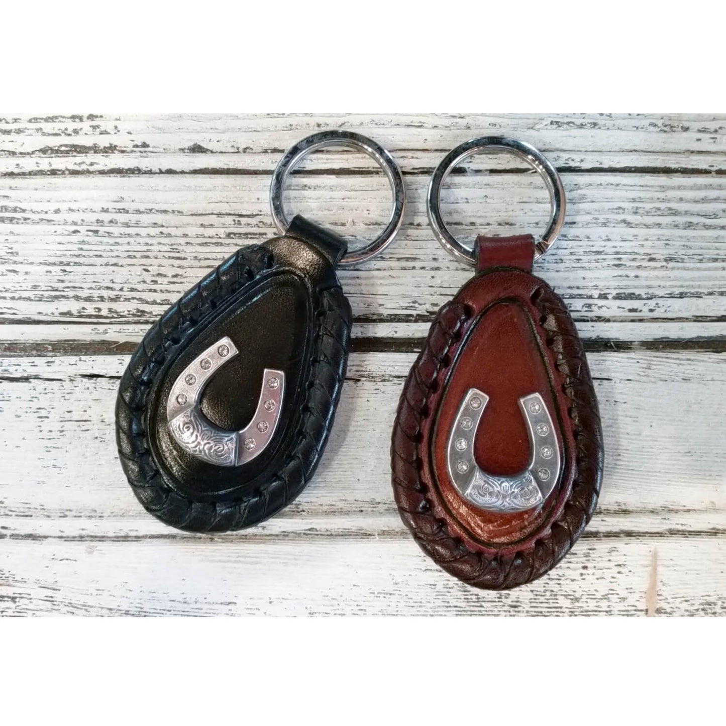 Keychains make your load of keys unique to you as well as making them easier to find in your purse. This stylish keychain has tiny rhinestones to glamorize the Horseshoe Concho. Measures Approximately 2-1/2"L x 2"W