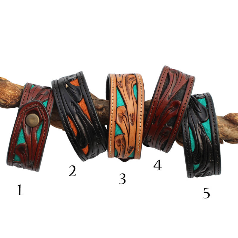 Stylish bracelets of tooled-leather laid over a solid colored leather layer creating a unique contrasting overlay. These bracelets are for men or women with two size snap closure of 7-½” or 8-½”. Measure 1” wide. Made in USA.