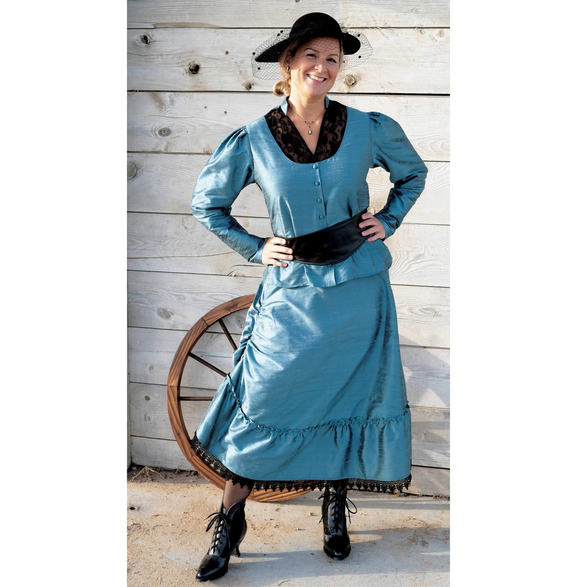 The Isabel Outfit is sure to give you that Wild West look with class and sophistication. The black lace inset on the blouse and black lace trim on the skirt have excellent contrast with the elegant purple or teal fabric. The skirt has an inside casing to cinch up the right side of the skirt up for a different look. Skirt ties in the back to give a slight bustle effect. Skirt measures about 32” long. Dry Clean Recommended. Isabel Belt & Hat Sold Separately. Polyester Dupioni Fabric. Made in USA.