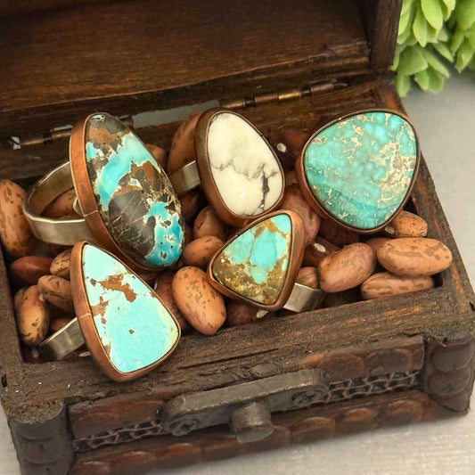 Set of rings with turquoise stones in a wooden box