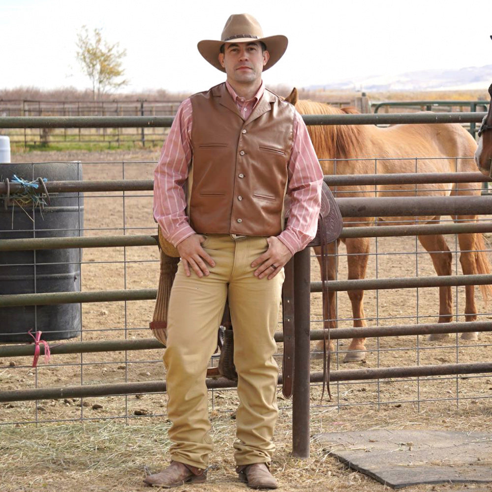 These classic button fly work pants have a jean look and are made of sturdy cotton canvas that matches our Duke Vest. Pants are a regular fit with two front and rear pockets. Belt loops on the waistband. Pant leg made to fit over cowboy boots. The more you wear them the more you’ll love them. 36” inseam.