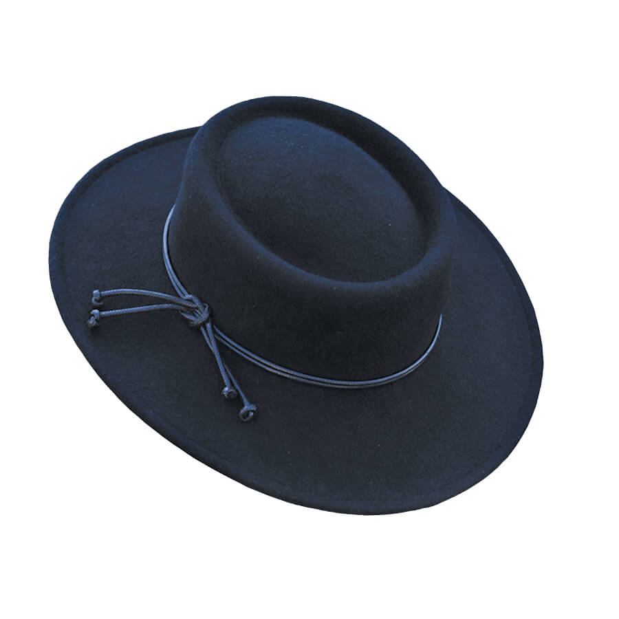 A classic shaped hat that boasts the days of the Frontier. Showcasing a narrow 3” brim and 3” telescoped Gambler crown with a gorgeous black leather cord wrapped around the brim and knotted on the side. Made for the rugged and tough lady of the West. Unlined wool-felt. This is a one size 22 ½” head size with an adjustable ribbon sweat band.