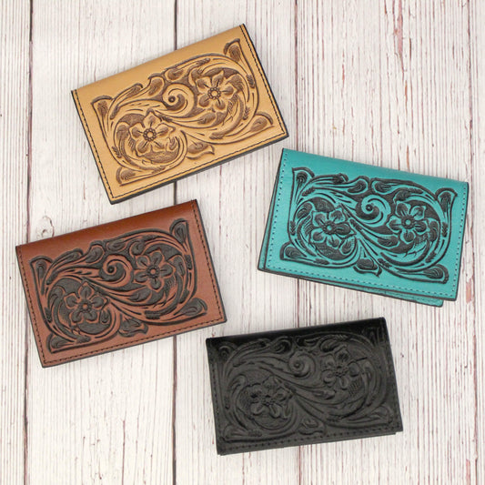 Western leather ID and business card holder perfect for throwing in a pocket or purse. All pieces are crafted of genuine leather hand-carved with 4 inside slots perfect for credit cards or business cards. Measures 4” x 2-¾”