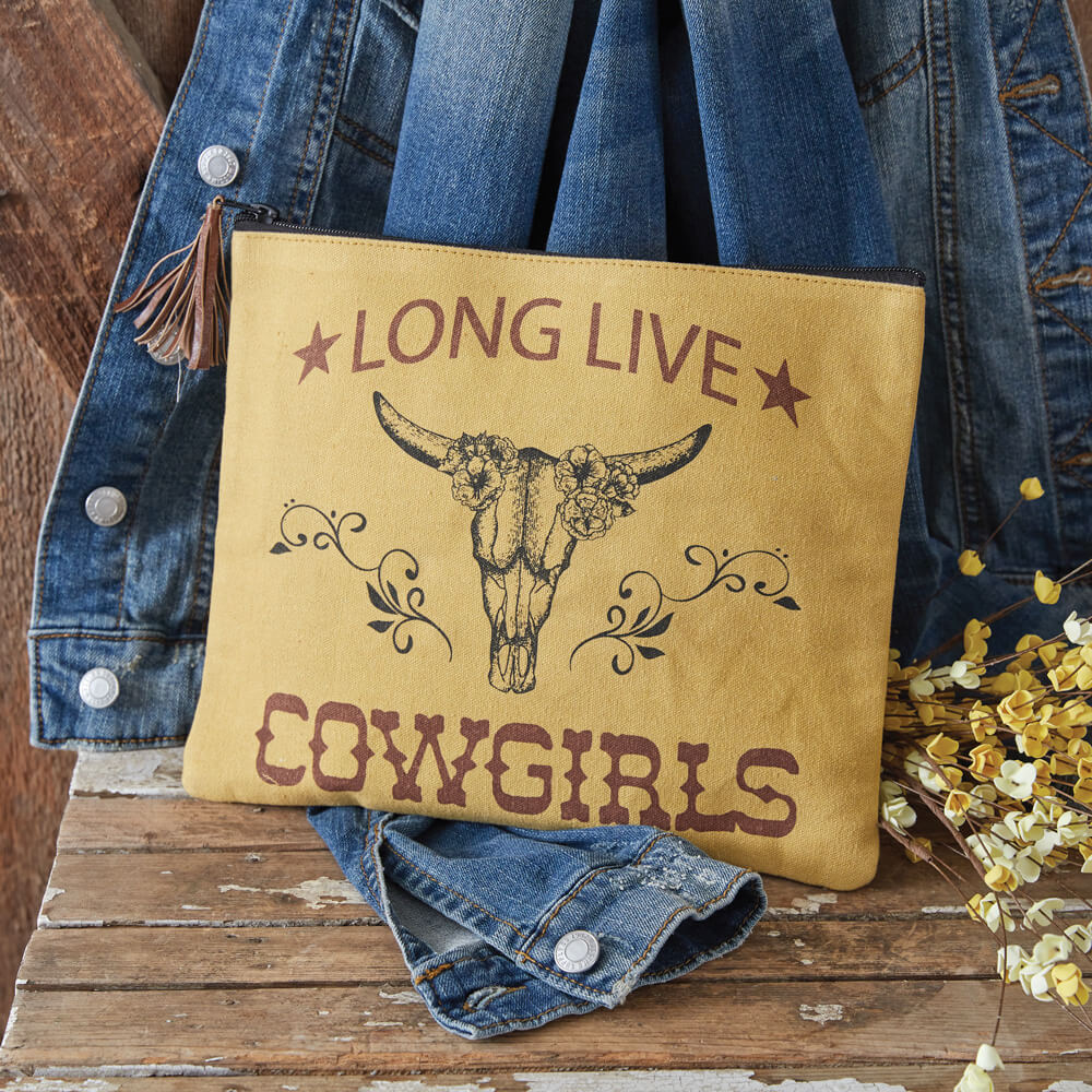 Cowgirls need their makeup too! This fun makeup travel bag is a great way to store makeup, toiletries, or even a tablet! This bag is made of canvas with a ticking liner and zippered closure. It also features a fun leather tassel pull. Measurement: 11''W x 9''H