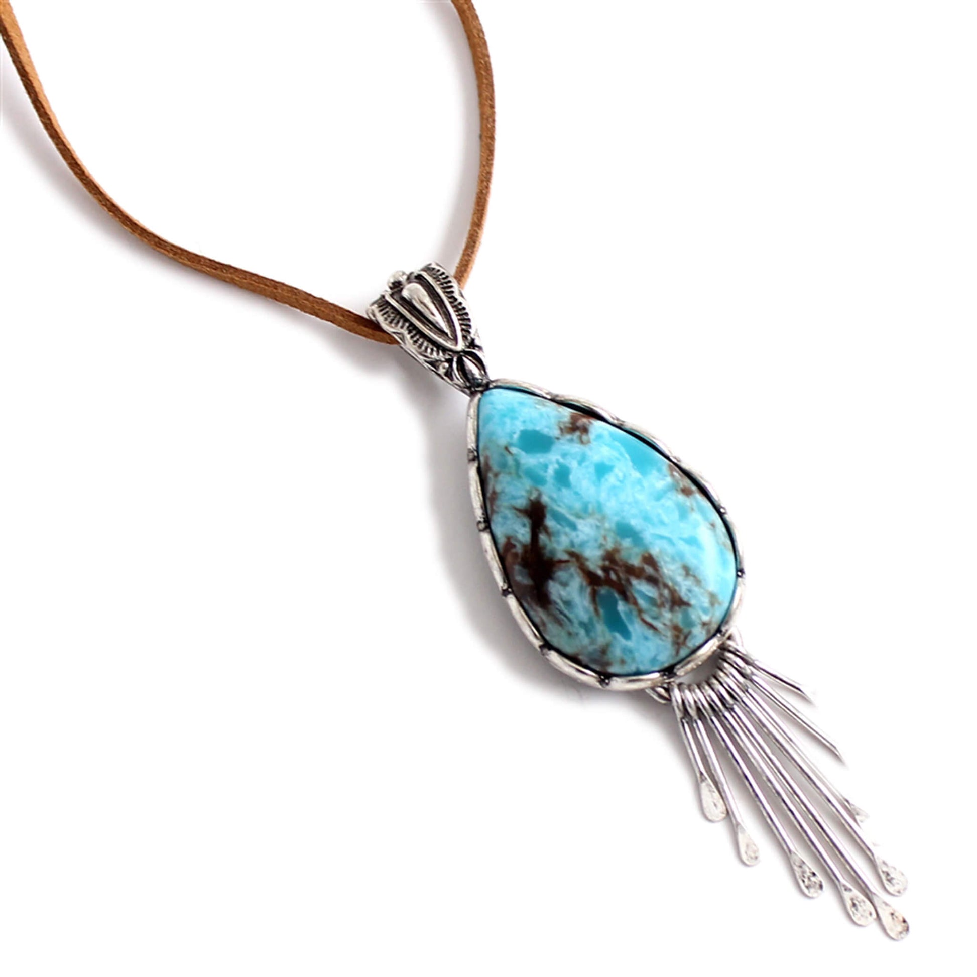 Stylish Long Cowgirl necklace with a turquoise drop pendant and silver tassel like design. A go to accessory for any western style and great for layering. Measures 36" long. Imported.