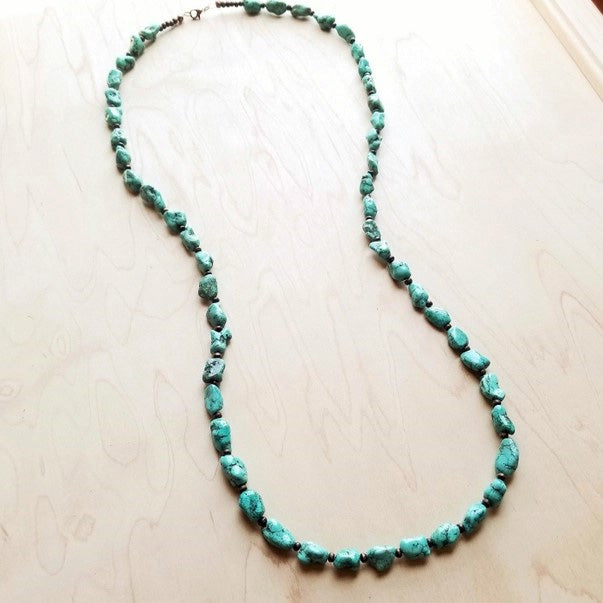 We've got heart eyes for this long turquoise necklace! This long boho necklace is made up of howlite turquoise chunks. This turquoise stone necklace is the perfect item to layer with shorter necklaces and boho statement necklace. Add this turquoise stone necklace to your unique handmade jewelry collection! Although your handmade beaded necklace will resemble the photo, each piece is created by hand, so no two are identical. Length: 42 Inches, no extender Bead Size: 4-14mm