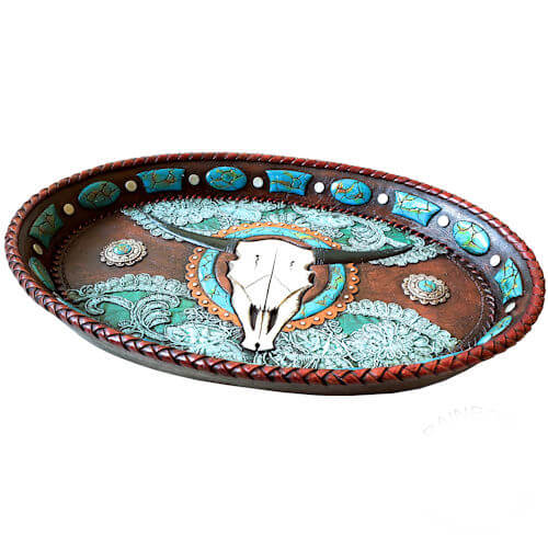 Designed to corral all your daily essentials in one spot, the Longhorn Tray keeps your space organized with a stylish twist. Its generous surface area provides ample room for wristwatches, pocket change, rings, earrings, cufflinks, and anything else that tends to get left behind at the end of the day. Give your bedroom or entryway a taste of the open range with this eye-catching rustic accent piece. 9 X 12.5 X 1.5