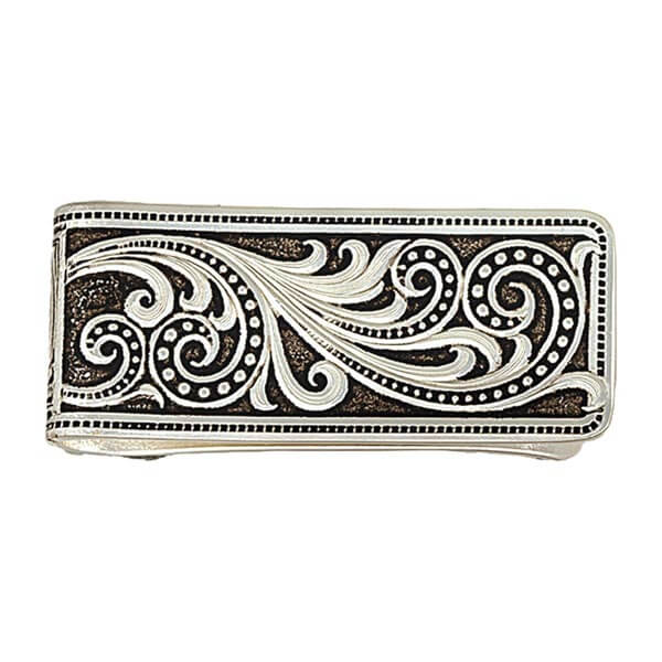 This money clip has an antiqued silver finish with open filigree curls in an elegant paisley shape. The traditional Western bright cut engraving is accented with a hand-painted black ribbon of delicately sized pinpoints, like fine stitching or resembling delicate lace. Measures about 7/8" high by 2-1/8" long.