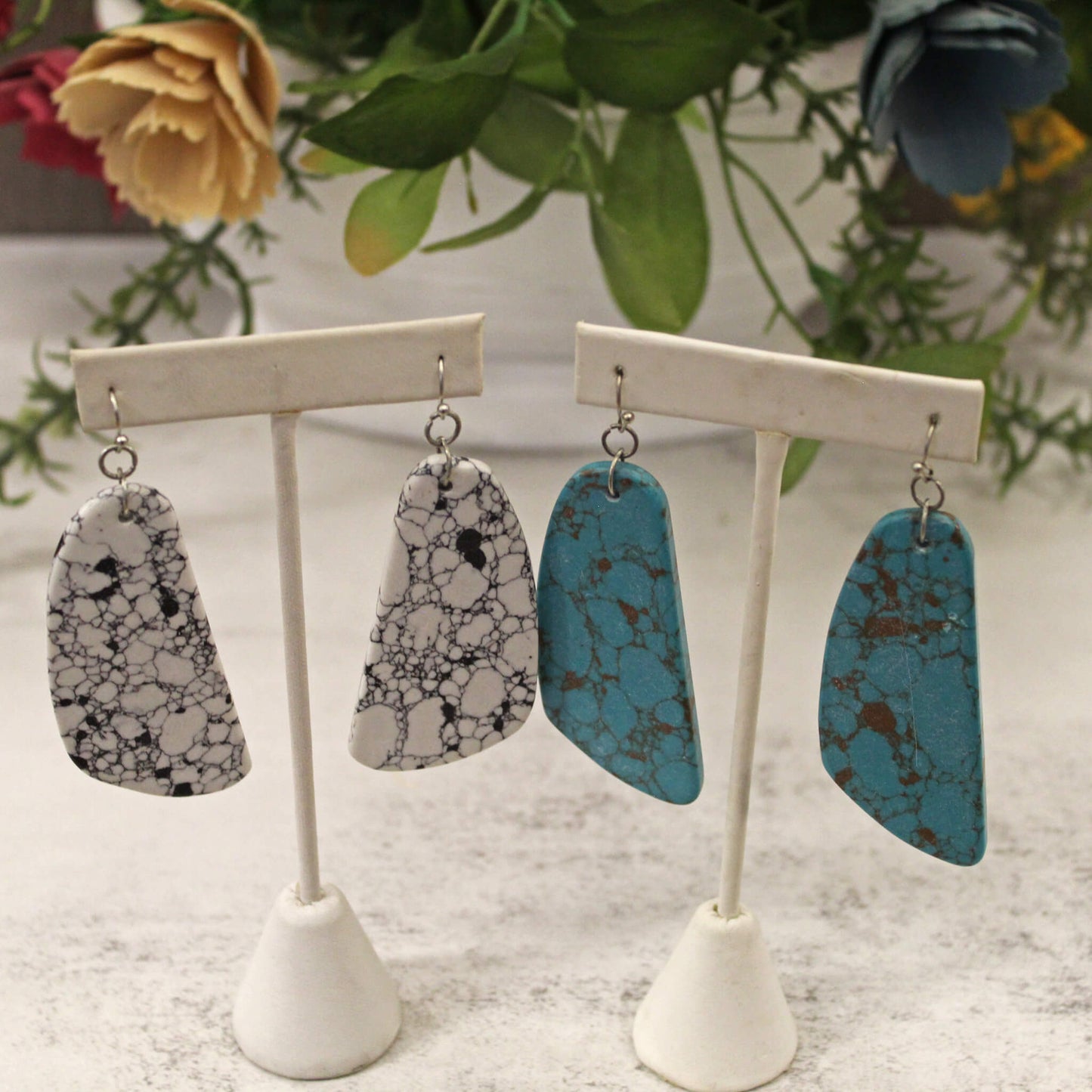 Simple and Bold! These are hook back earrings, resembling a slab of marble stone that are about 2" long. The marbling varies with each stone, choose white or turquoise. Lightweight, always lead and nickel free, and hypo-allergenic.