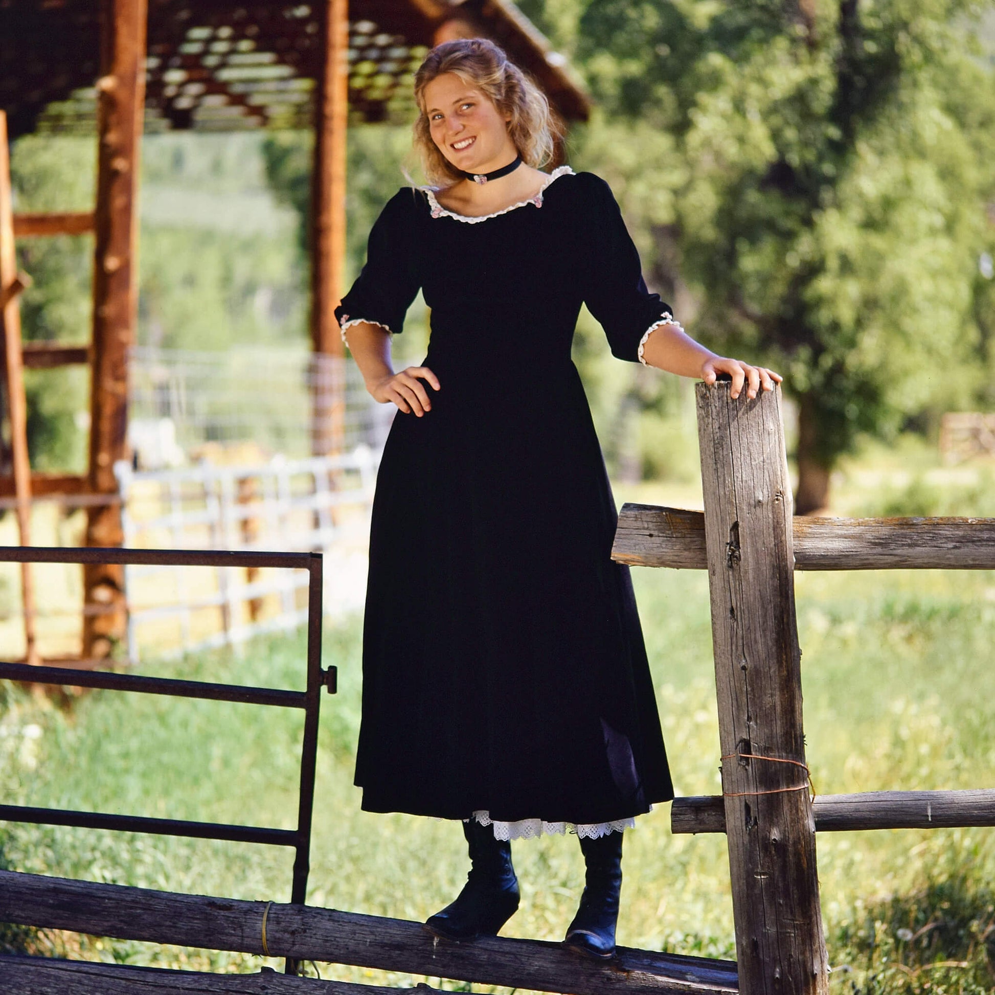 Black velvet and lace accented by silk rosettes come together for the dress worn by the queen of the West, the Maverick Queen. Be queen for a day or for a night with this figure flattering dress. Features include drop front V waist, scoop neck, three quarter length sleeves, and two side pockets. Made of 100% cotton velvet. Dry cleaning recommended. Petticoat Sold Separately. Made in USA.