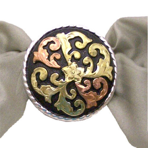 This is a round scarf slide great with black metal background has a silver border and two-tone design in copper and gold. Goes great with many scarves. Measures 1 1/4" diameter. Made in USA.