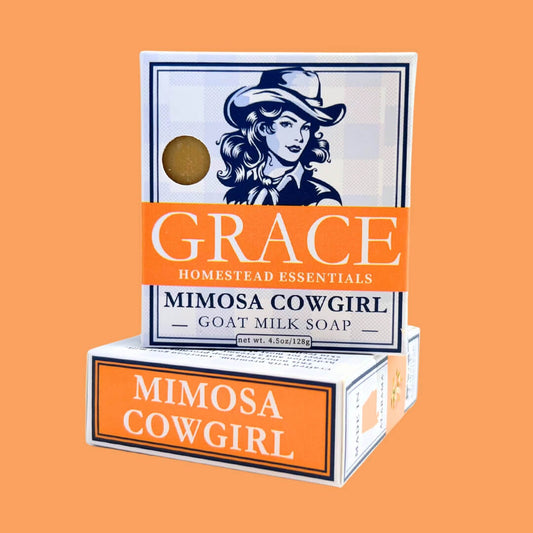 Soap packaging with 'Grace Homestead Essentials' branding on an orange background
