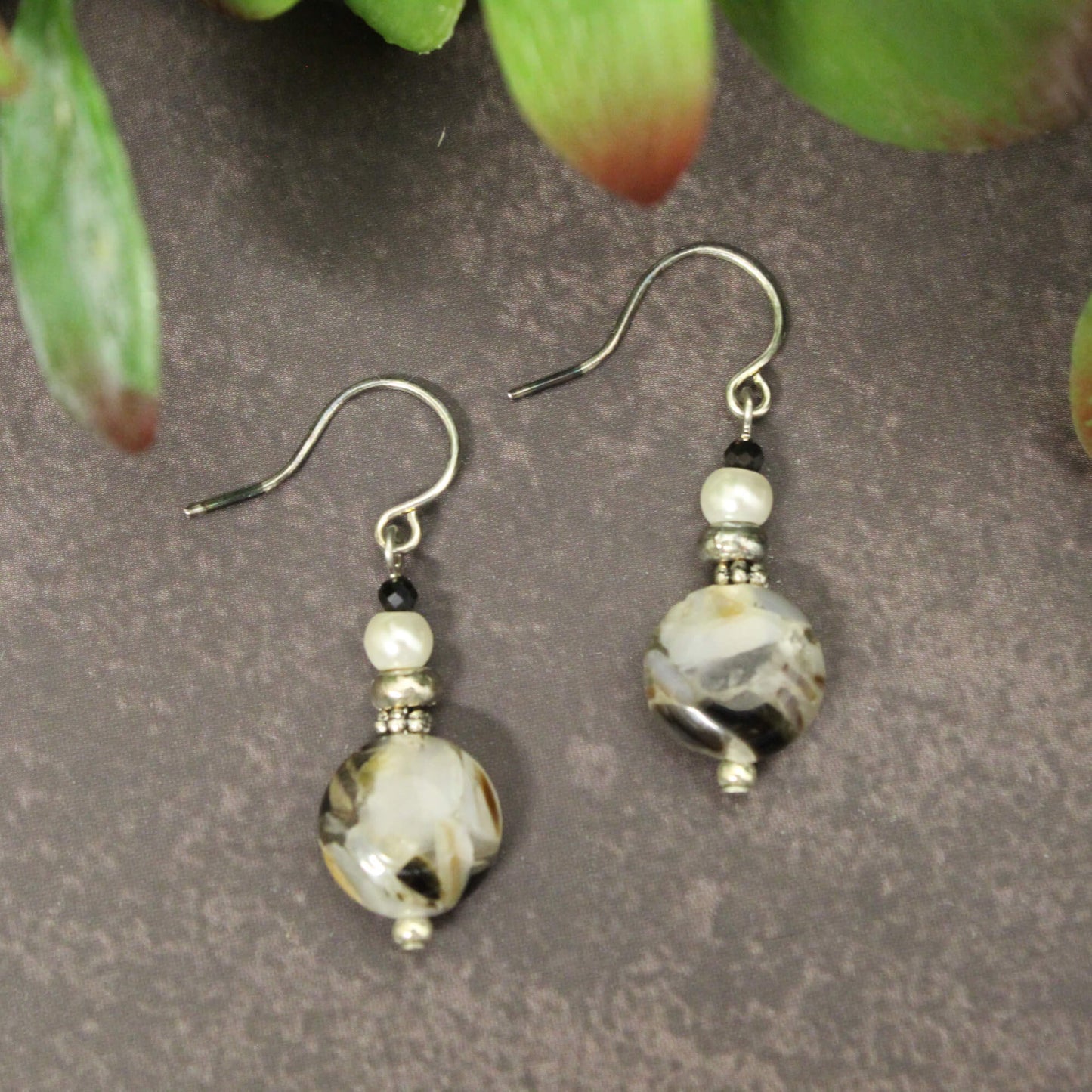 Mother of pearl is believed to promote emotional harmony and invite prosperity. These earrings capture the mesmerizing sheen of this natural gemstone, • Measures approx. .25" across and .75" from the base
• Hypo-allergenic ear wires for all-day comfort
• Made in the USA with high-quality materials elevating your look while supporting your wellbeing. Treat yourself or surprise a loved one with a gift that blends beauty and meaning.