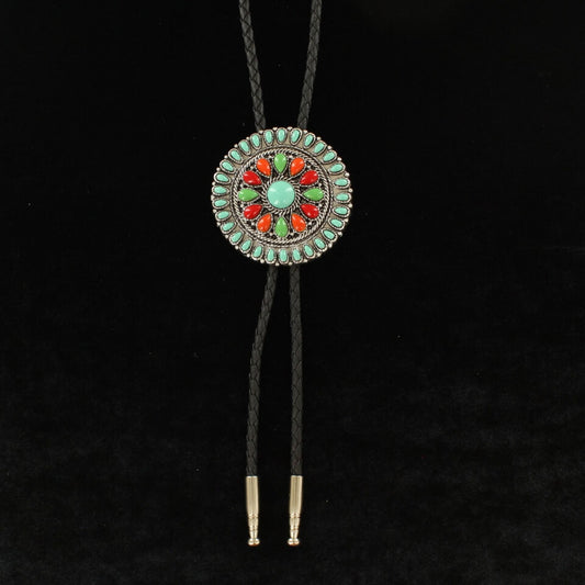 Stylish and colorful bolo tie with a large round, multicolor stone concho on a black leather cord. This bolo tie will certainly get you noticed. 