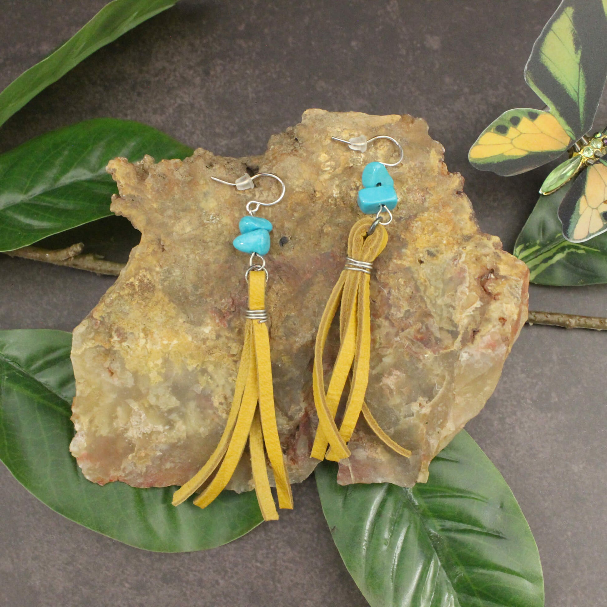 Whether you're dressing up for a special occasion or adding a touch of Southwestern flair to your everyday look, the Mustard Buckskin Earrings are sure to turn heads. Handmade with care in the USA, these earrings are a testament to the skilled craftsmanship and attention to detail that goes into every piece. Treat yourself or surprise a loved one with this unique and eye-catching accessory that will elevate your style and capture the spirit of the American frontier.