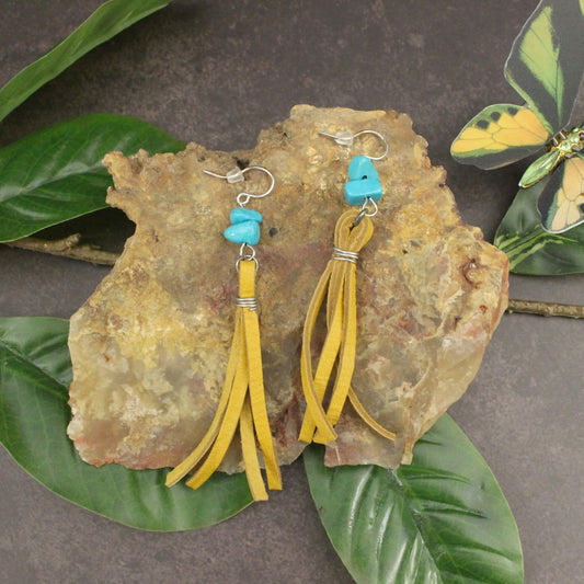 Whether you're dressing up for a special occasion or adding a touch of Southwestern flair to your everyday look, the Mustard Buckskin Earrings are sure to turn heads. Handmade with care in the USA, these earrings are a testament to the skilled craftsmanship and attention to detail that goes into every piece. Treat yourself or surprise a loved one with this unique and eye-catching accessory that will elevate your style and capture the spirit of the American frontier.