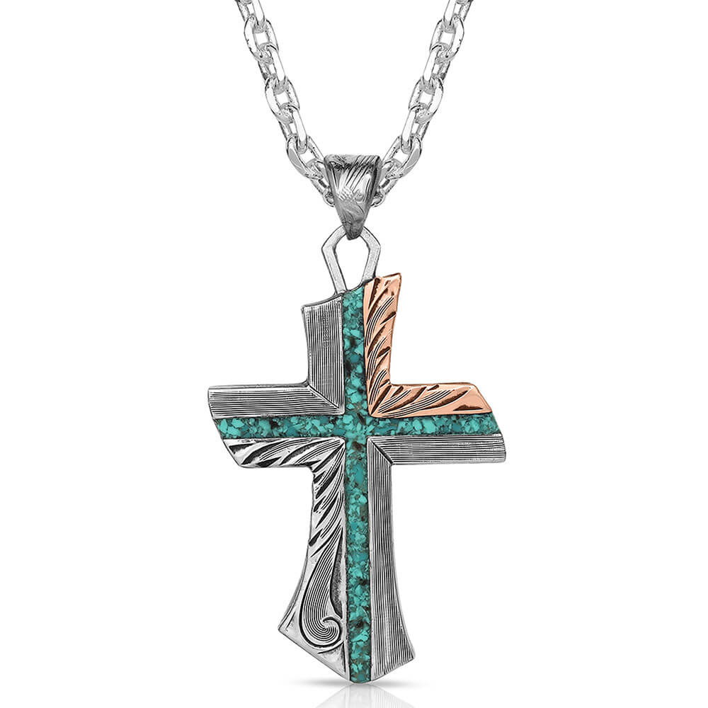 This necklace has an opal cross at it's center. It has feathering and filigree etches. The upper right corner of the cross is copper-toned and it is suspended from a 28" linked chain. Pendant measures 2.3 x 1.3 inches.