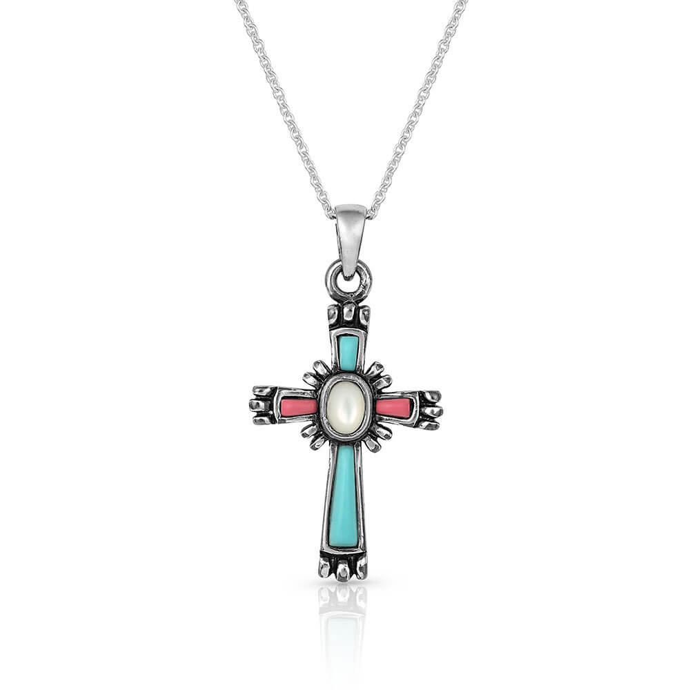 <span>Cross necklace that hangs from a silver-finished clasp and has turquoise with coral-pink gems within the cross. Small figures exude from the corners of the cross with a white mother of pearl stone in the center. It hangs from a 19" silver-toned chain.&nbsp;</span><span>Rhodium over a brass base. Paint. Compressed colored turquoise stones. Mother of Pearl. Pendant measures 1.5" x .75"