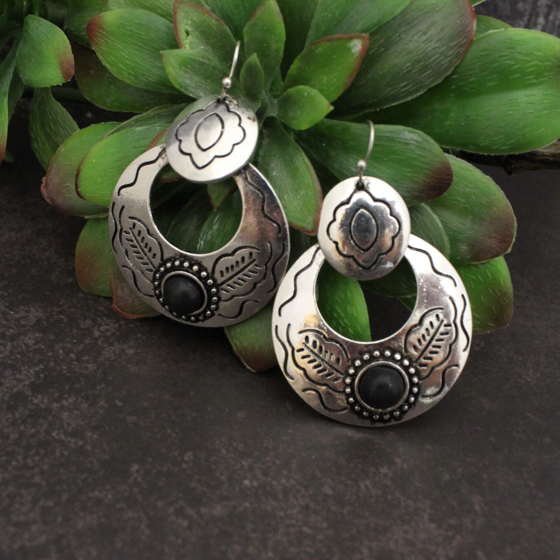 These earrings blend timeless sophistication with a touch of modern flair. The intricate pattern and bold color combination create a look that is both eye-catching and versatile. Embrace your inner goddess and let these earrings be the crowning glory of your style.