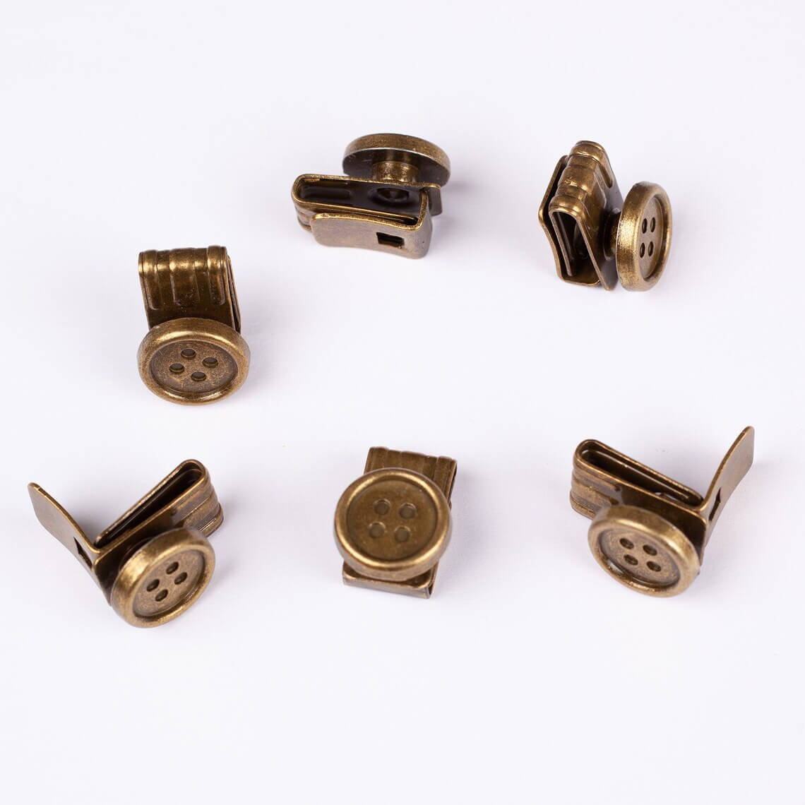 Set of bronze-colored buttons on a white background