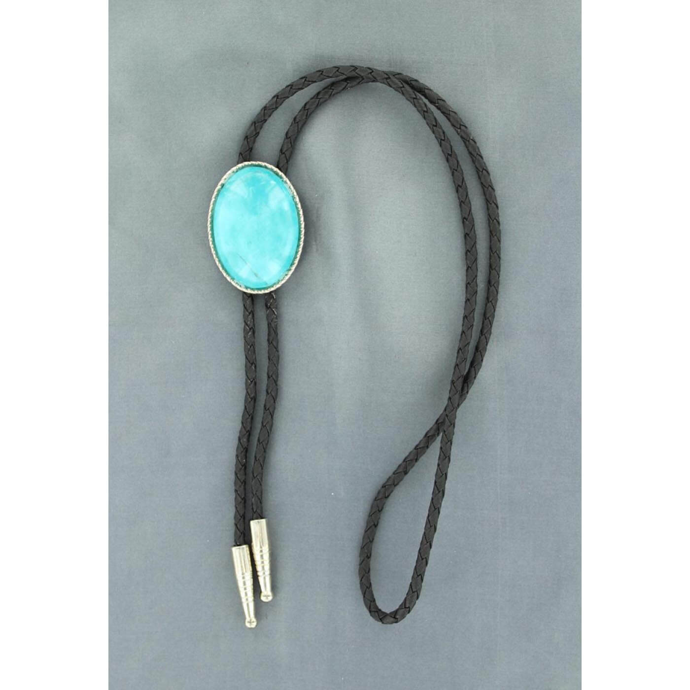 For a distinctly Southwestern look during formal occasions, you'll like this oval-shaped turquoise bolo tie. The slide contains a rope-like edge around an oval turquoise stone. The tie itself is made with braided black leather. Imported 36" Long